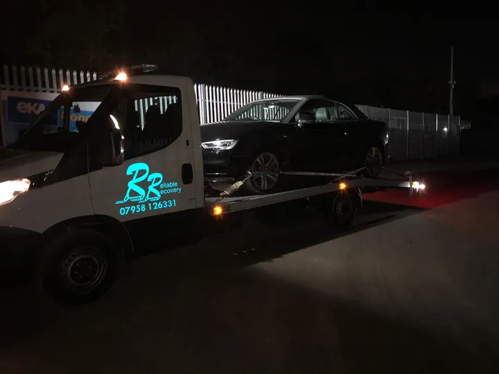 Recovery vehicle loading a car in London