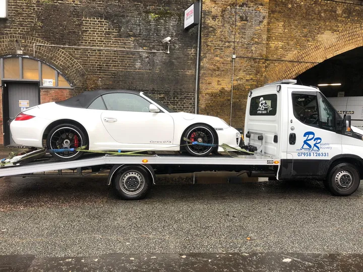 Sports car being transported by Reliable Recovery