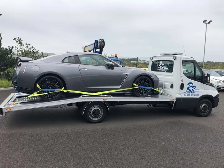 Vehicle recovery truck loading a car in London